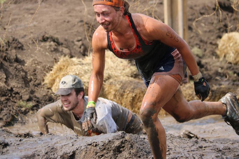 Tough Mudder participant running through the last obstacle Electroshock