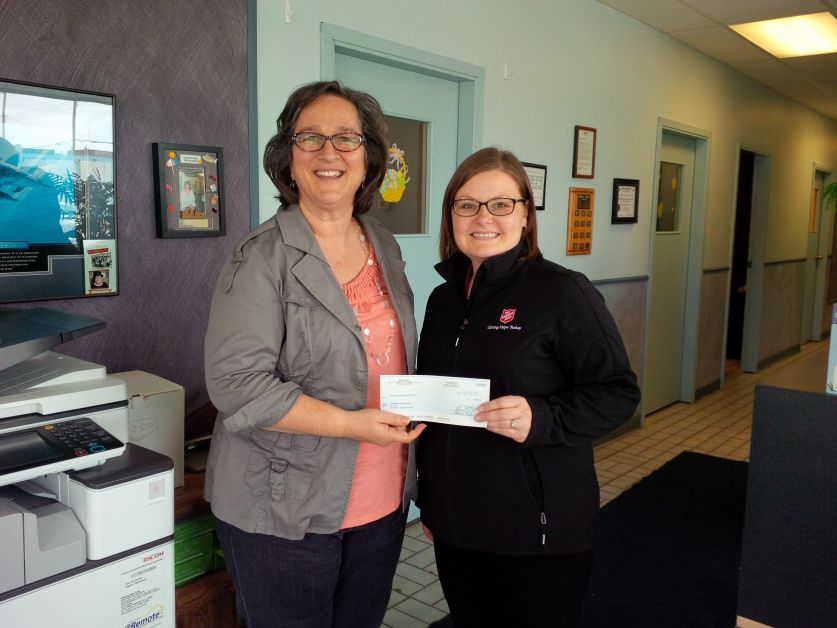 D.A.R.T.S. Executive Director Lorelei Martin presents cheque to Jennifer Hillier of the Salvation Army