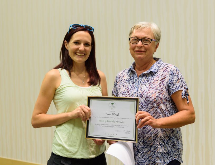 Terri Woods recieves her award for ten years of dedication with the Roots of Empathy program