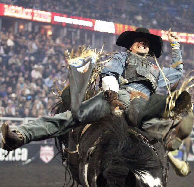 Goodine hangs on for dear life at a rodeo competition from earlier this year - Submitted photo