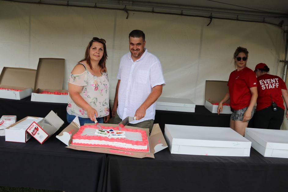 Drumheller Councillors Lisa Hansen-Zacharuk and Patrick Kolafa cut the cake in celebration of Canada 150 on July 1, 2017