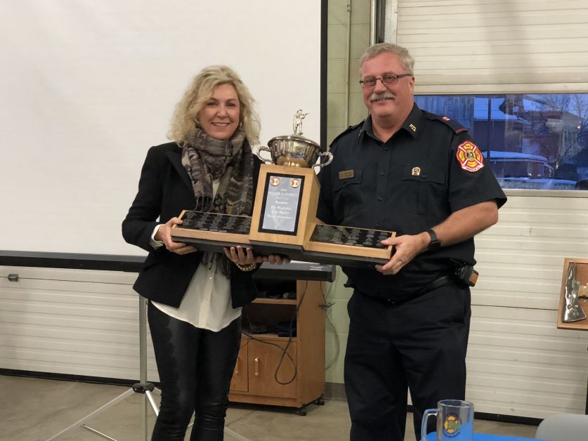 Keith Hodgson, right, was presented the Mayor’s Award for best percentage attendance to fire calls and practices. He received the award from Mayor Heather Colberg.