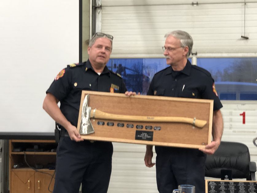 Rick Schinnour, right, was awarded the Rollie Yavis Award for extra effort around the hall. He was presented the award by Deputy Chief Duane Bolin. The award was named in honour of  long time fire captain, the late Rollie Yavis.