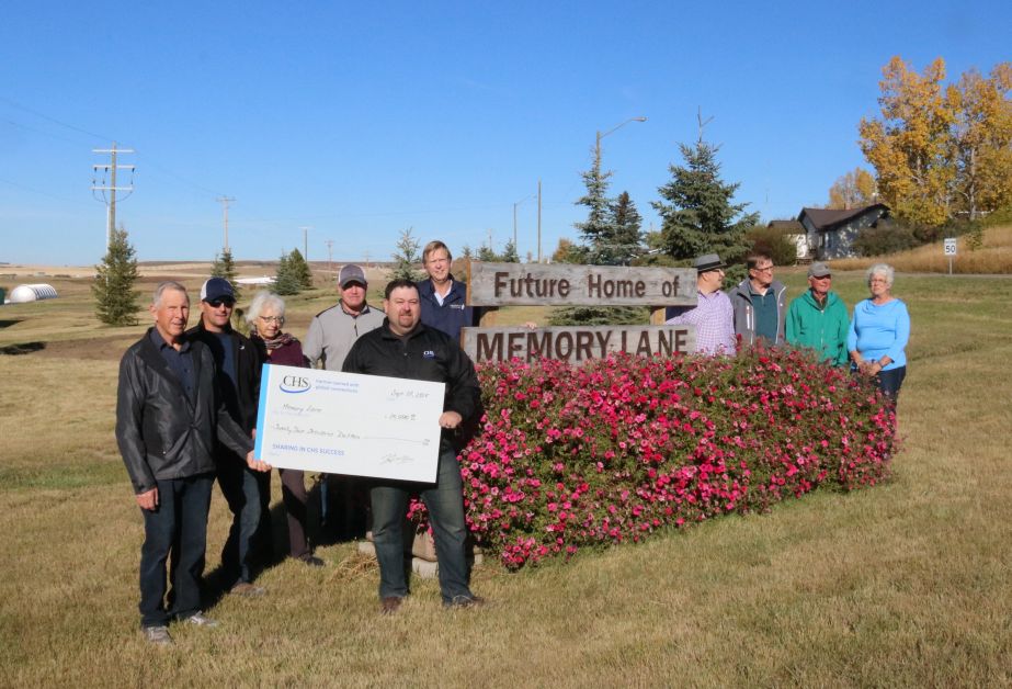 Cutline.  CHS Ag Service donated $25,000 to the Standard Community Facility Enhancement Society for the Memory Lane project. At the donation are (l-r) Society president Don Sundgaard,  Ben Waldner  of CHS,  society secretary Louise Welen, Mike Sauve and Mike Hira of CHS, Alan Larsen, Larry Casey, Moe Zaleschuk, Jackie Jensen and Joanne Petersen of the society. Missing is Ron Corbiell. mailphoto by Patrick Kolafa