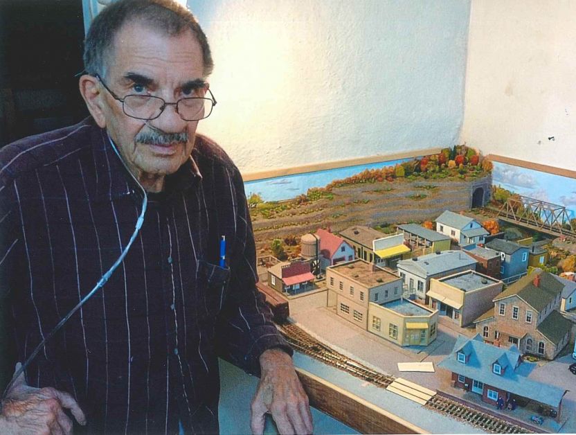 Jim Goudy with his train set. Recently his family donated it to the  Badlands Historical Centre. submitted