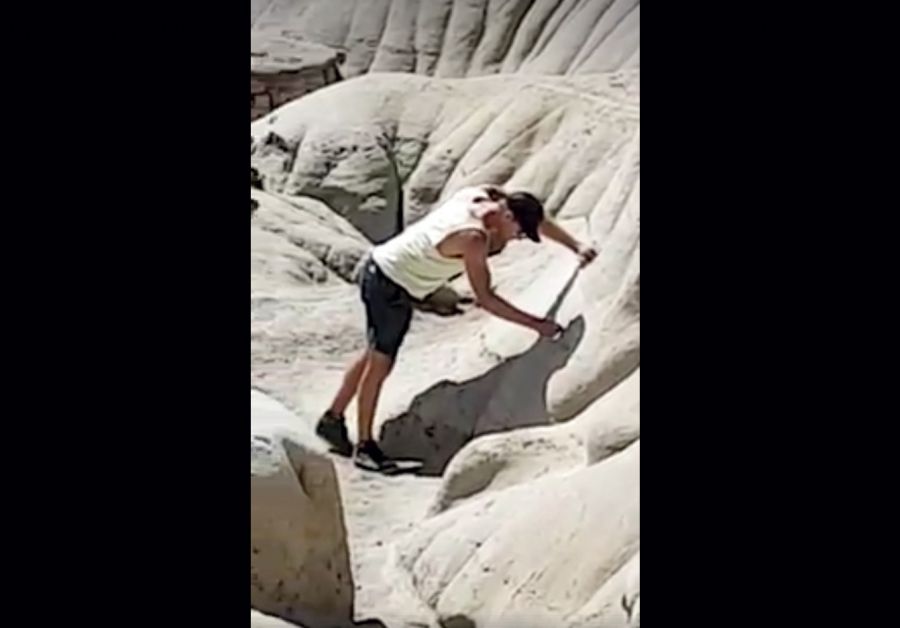 A man is caught on video defacing the protected hoodoo site east of Drumheller, Alberta, on August 3, 2017