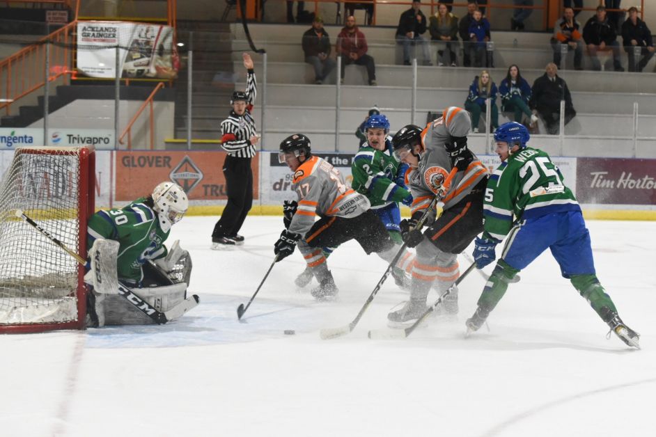 Canucks goalie Kolby Matthews, 30, anticipates the incoming offence Drumheller Dragons defenseman Troy Dudley, 17, and forward Slater Dykema, 11. Calgary Canucks defenseman Brody Medeiros, 2, and centre player Zach Webb, 25, were hot on their trail to intercept the potential goal. The Dragons ultimately won the game 6 – 3. Mailphoto by Terri Huxley