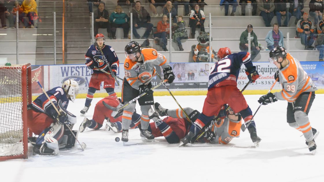 The Drumheller Dragons attempt to score on the opponents net in the second period of Game 4. The Drumheller Dragons faced off against the Brooks Bandits for Game 4 of the second round of playoffs on Tuesday, March 20. This game was the final do or die for the Dragons as the Bandits won the last three games. The Dragons came out on top and won 3 – 2. Mailphoto by Terri Huxley